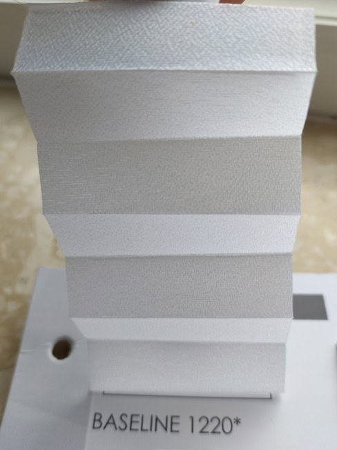 White upright stepped block with alternating light gray faces, resting on a base labeled BASELINE 1220